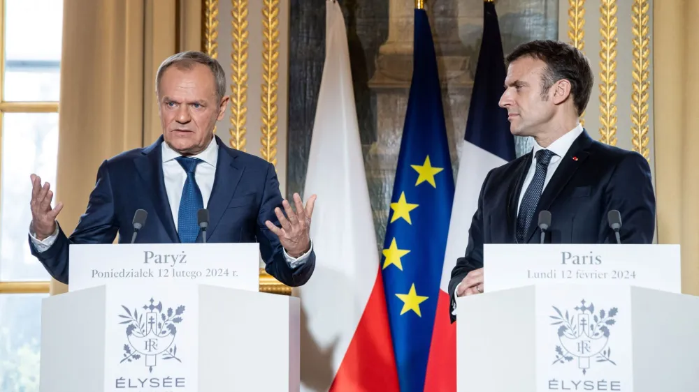 French President Emmanuel Macron and Polish Prime Minister Donald Tusk deliver a statement to the media as part of their meeting at Elysee Palace, Paris, France, 12 February 2024. Christophe Petit Tesson/Pool via REUTERS