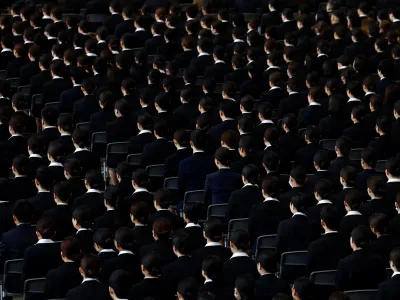 Newly hired employees of Japan Airlines (JAL) group attend an initiation ceremony at a hangar of Haneda airport in Tokyo, Japan, April 1, 2024. REUTERS/Issei Kato
