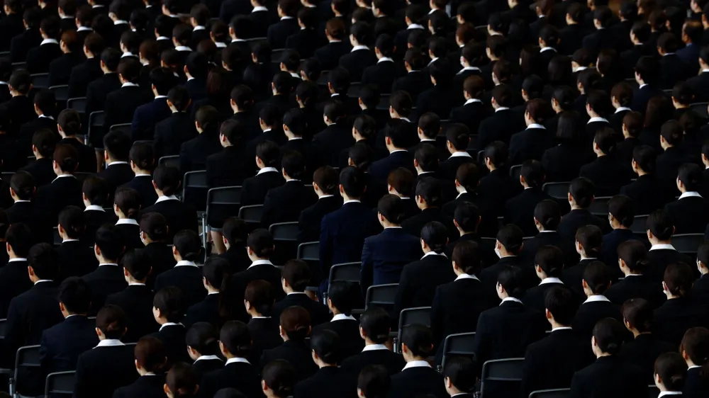 Newly hired employees of Japan Airlines (JAL) group attend an initiation ceremony at a hangar of Haneda airport in Tokyo, Japan, April 1, 2024. REUTERS/Issei Kato