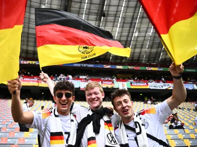 14 June 2024, Bavaria, Munich: Germany fans cheer in the stands ahead of the UEFA Euro 2024 Group A soccer match between Germany and Scotland at Munich Football Arena. Photo: Tom Weller/dpa