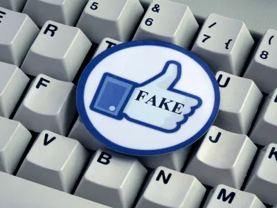 ILLUSTRATION - A "Like" button with the word "FAKE" on it lies on top of a computer keyboard. Taken on 18.12.2016. Facebook is a social network run by the US-American company of the same name, Facebook Inc. Despite serious criticism, Facebook does not want to take on responsibility for deleting so-called "fake news" themselves. Instead they will give a team of external experts the task. "Fake news" refers to false and incorrect information, often spread on purpose via electronic channels (mainly social media). They are deliberately spread by journalists, office-holders, politicians, companies and private individuals. - NO WIRE SERVICE - Photo by: Sascha Steinach/picture-alliance/dpa/AP Images