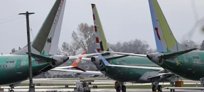 FILE- In this Nov. 14, 2018, file photo Boeing 737 MAX 8 planes are parked near Boeing Co.'s 737 assembly facility in Renton, Wash. Investigators were rushing to the scene of a devastating plane crash in Ethiopia on Sunday, March 10, 2019, an accident that could renew safety questions about the newest version of Boeing's popular 737 airliner. (AP Photo/Ted S. Warren, File)