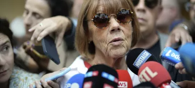 Gisele Pelicot speaks to media as she leaves the Avignon court house, southern France, Thursday, Sept. 5, 2024. A woman allegedly drugged by her ex-husband so that she could be raped by other men while she laid unconscious, is expected to testify before a panel of French judges. (AP Photo/Lewis Joly)