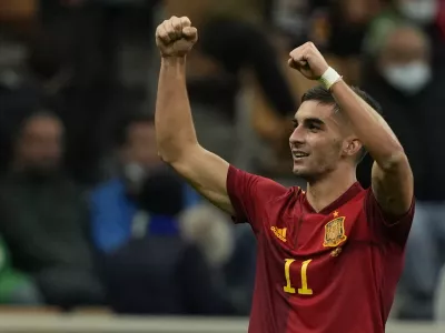 FILE - Spain's Ferran Torres celebrates after scoring during their Nations League semifinal soccer match against Italy at the San Siro stadium, in Milan, Italy, Oct. 6, 2021. Barcelona has completed the signing of Spain forward Ferran Torres from Manchester City, it was announced Tuesday, Dec. 28. Barcelona said Torres will have a buyout clause of 1 billion euros (.13 billion). (AP Photo/Antonio Calanni, file)