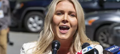 FILE - Karoline Leavitt speaks to the news media across the street from Republican presidential nominee former President Donald Trump's criminal trial in New York, May 28, 2024. (AP Photo/Ted Shaffrey, File)