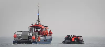 31 May 2025, France, Gravelines: French authorities escort people thought to be migrants onboard a small boat leaving the beach at Gravelines, France, in an attempt to reach the UK by crossing the English Channel. Photo: Gareth Fuller/PA Wire/dpa