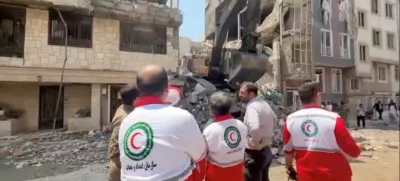 Rescuers work at the site of a damaged building, in the aftermath of Israeli strikes, in location given as Tehran, Iran, in this screen grab from a handout video released on June 14, 2025. Iranian Red Crescent Society/Handout via REUTERS ATTENTION EDITORS - THIS PICTURE WAS PROVIDED BY A THIRD PARTY. NO RESALES. NO ARCHIVES. MANDATORY CREDIT