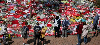 Fans pay their respects outside Anfield Stadium, following the death of Liverpool Football Club soccer player Diogo Jota, in Liverpool, Britain, July 7, 2025. REUTERS/Phil Noble