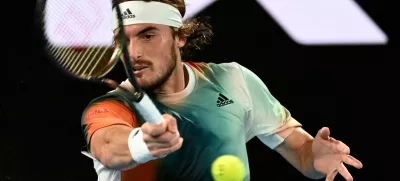 ﻿Tennis - Australian Open - Melbourne Park, Melbourne, Australia - January 26, 2022 Greece's Stefanos Tsitsipas in action during his quarter final match against Italy's Jannik Sinner REUTERS/Morgan Sette