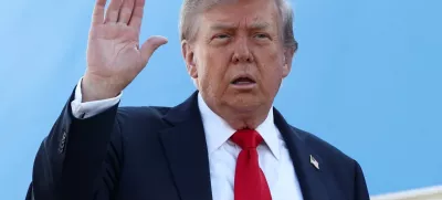 U.S. President Donald Trump waves while boarding Air Force One, as he departs for Alaska to meet with Russian President Vladimir Putin to negotiate for an end to the war in Ukraine, from Joint Base Andrews in Maryland, U.S., August 15, 2025. REUTERS/Kevin Lamarque