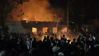 Flames engulf Grahadi Building, the official residence of East Java governor, in Surabaya, East Java, Indonesia, Saturday, Aug. 30, 2025, after it was set on fire during a protest sparked by reports of lawmakers receiving excessive housing allowances. (AP Photo/Trisnadi)