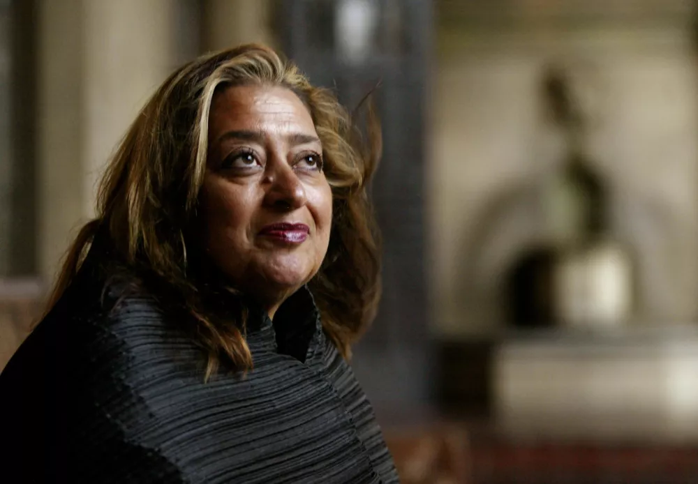 ﻿FILE- In this March 21, 2004 file picture, Iraqi-British architect Zaha Hadid poses in West Hollywood, Calif. Hadid, whose modernist, futuristic designs included the swooping aquatic center for the 2012 London Olympics, has died aged 65, Thursday, March 31, 2016. (AP Photo/Kevork Djansezian, File)