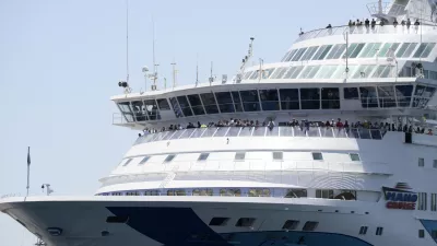 A cruise ship carrying Israeli tourists try to approach the Aegean Sea island of Syros, Greece, Tuesday, July 22, 2025. (Nikos Panagiotopoulos/InTime News via AP)