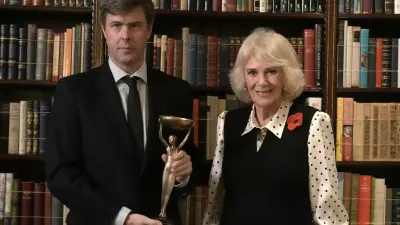 Britain's Queen Camilla poses for a photo with 2025 Booker prize winner David Szalay during a reception for shortlisted authors, judges and supporters, celebrating the Booker Prize 2025 and the newly announced Children's Booker Prize, at Clarence House in London, Britain, November 11, 2025. Stefan Rousseau/Pool via REUTERS