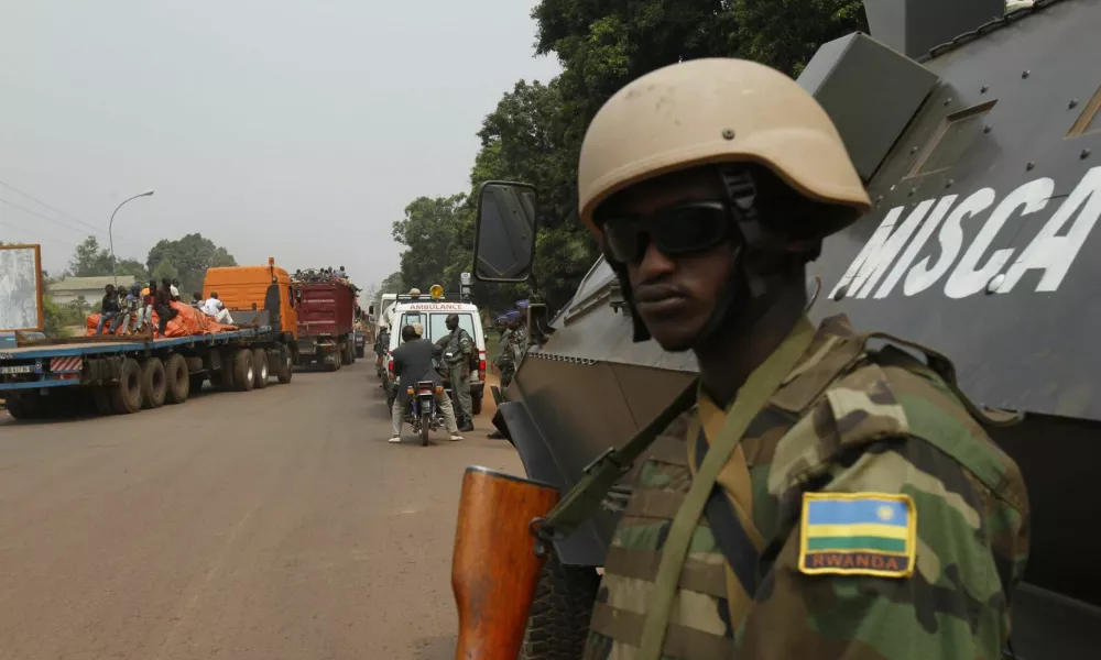 ﻿African peace keeping soldiers escort a humanitarian convoy in Bangui, February 15, 2014. France said on Friday it plans to send another 400 troops to help combat a crisis in the Central African Republic as U.N. chief Ban Ki-moon pleaded for more swift, robust international help to stop sectarian violence that could turn into a genocide. REUTERS/Luc Gnago (CENTRAL AFRICAN REPUBLIC - Tags: POLITICS CIVIL UNREST MILITARY) - RTX18VGQ