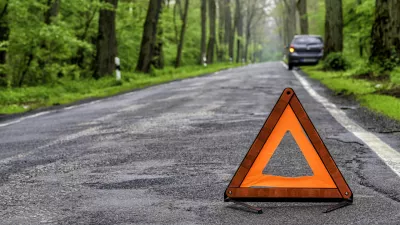 damaged car on a country road after a breakdown