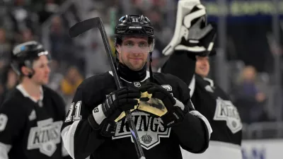 Apr 23, 2025; Los Angeles, California, USA; Los Angeles Kings center Anze Kopitar (11) makes a heart with his gloves for he daughter after defeating the Edmonton Oilers in game 2 of the 2025 Stanley Cup Playoffs at Crypto.com Arena. Mandatory Credit: Jayne Kamin-Oncea-Imagn Images