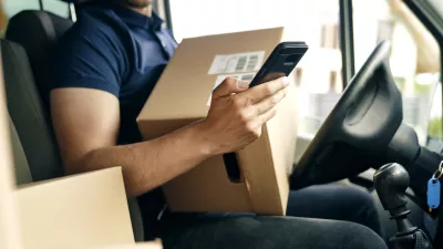 Close up of checking a package using portable information device
