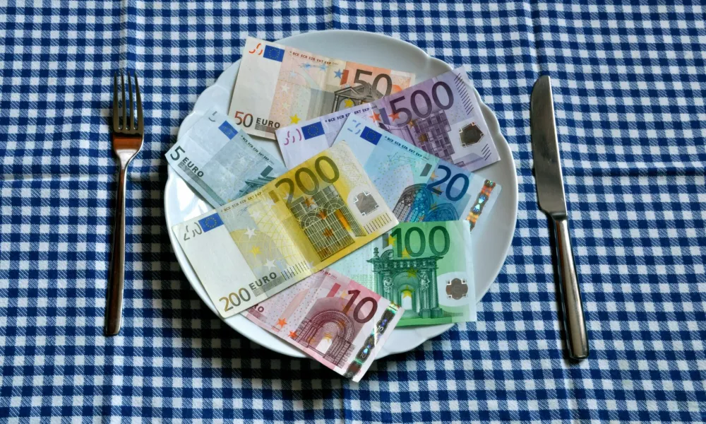 Illustration - Euro bills lie on a plate in Germany, 22 March 2011. Photo by: Berliner Verlag/Steinach/picture-alliance/dpa/AP Images