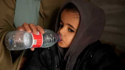 Displaced Palestinian child Yasser Arafat, 5, who, according to medics, suffers from severe acute malnutrition with nutritional edema, drinks water inside their family's tent at a displacement camp in Khan Younis, southern Gaza Strip, December 16, 2025. REUTERS/Haseeb Alwazeer