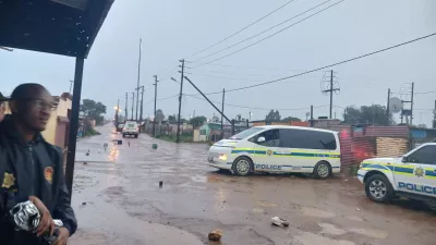 Police cars block a street near the scene after an early morning shooting in Bekkersdal township south-west of Johannesburg, South Africa, December 21, 2025. South African Police Services/Handout via REUTERS. ATTENTION EDITORS &ndash; THIS IMAGE HAS BEEN SUPPLIED BY A THIRD PARTY.