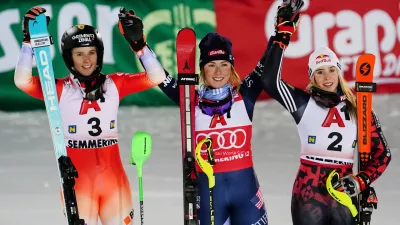 United States' Mikaela Shiffrin, center, winner of an alpine ski, women's World Cup slalom, poses with second placed Switzerland's Camille Rast, left, and third placed Albania's Lara Colturi, in Semmering, Austria, Sunday, Dec. 28, 2025. (AP Photo/Pier Marco Tacca)