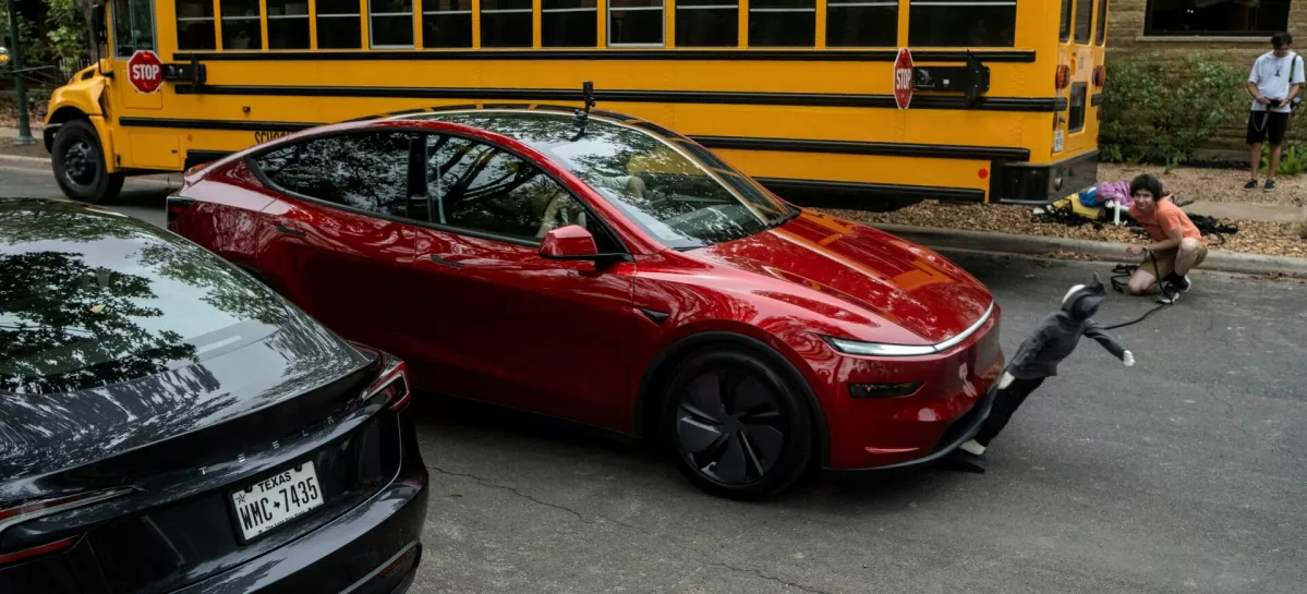 FILE PHOTO: Arthur Maltin, a test driver with The Dawn Project, hits a crash dummy as it crosses the road during a safety test on a Tesla Model Y's self-driving feature at a protest against Tesla robotaxis, ahead of the Tesla robotaxis' official services in Austin, Texas, U.S., June 12, 2025.  REUTERS/Joel Angel Juarez/File Photo
