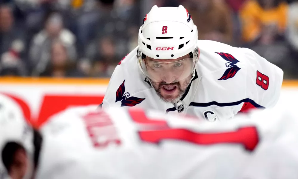 Washington Capitals left wing Alex Ovechkin (8) waits for the puck to be dropped during a face-off in the first period of an NHL hockey game against the Nashville Predators, Sunday, Jan. 11, 2026, in Nashville, Tenn. (AP Photo/Mark Humphrey)