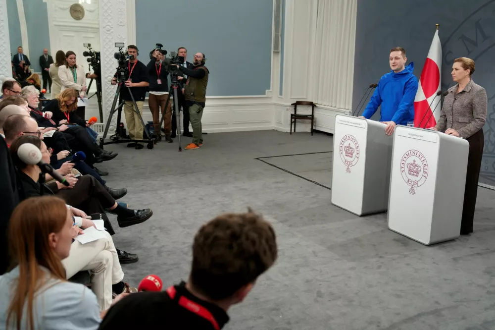 Chairman of Naalakkersuisut, Greenland's Prime Minister Jens-Frederik Nielsen and Danish Prime Minister Mette Frederiksen make a statement about the current situation at a press conference in the Hall of Mirrors at the Prime Minister's Office in Copenhagen, Denmark, January 13, 2026. Liselotte Sabroe/Ritzau Scanpix/via REUTERS  ATTENTION EDITORS - THIS IMAGE WAS PROVIDED BY A THIRD PARTY. DENMARK OUT. NO COMMERCIAL OR EDITORIAL SALES IN DENMARK.