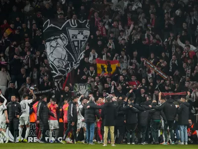 Albacete's players celebrate their team victory at the end the Copa del Rey round of 16 soccer match between Albacete and Real Madrid, in Albacete, Spain, Wednesday, Jan. 14, 2026. (AP Photo/Jose Breton)