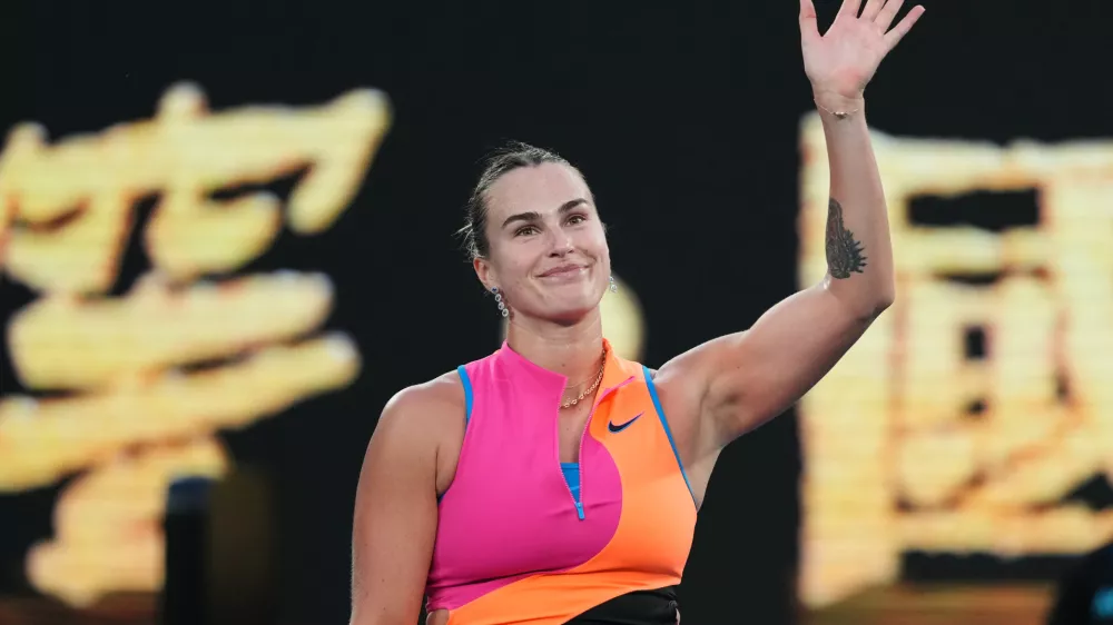 Aryna Sabalenka of Belarus waves after defeating Tiantsoa Rakotomanga Rajaonah of France in their first round match at the Australian Open tennis championship in Melbourne, Australia, Sunday, Jan. 18, 2026. (AP Photo/Dita Alangkara)