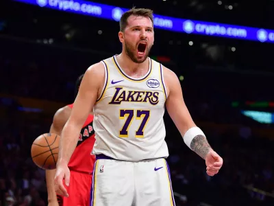 Jan 18, 2026; Los Angeles, California, USA; Los Angeles Lakers guard Luka Doncic (77) reacts during the first half at Crypto.com Arena. Mandatory Credit: Gary A. Vasquez-Imagn Images