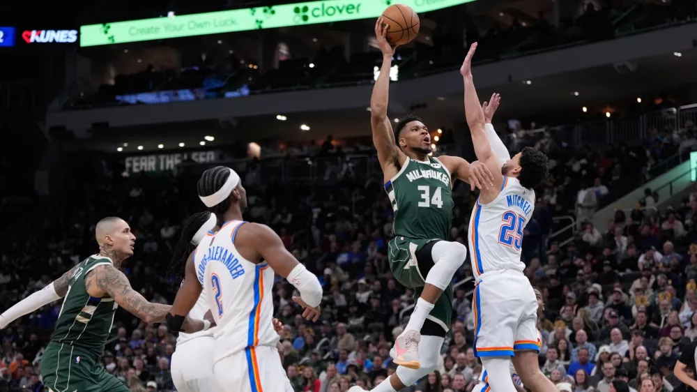 Milwaukee Bucks' Giannis Antetokounmpo shoots past Oklahoma City Thunder's Ajay Mitchell during the second half of an NBA basketball game Wednesday, Jan. 21, 2026, in Milwaukee. (AP Photo/Morry Gash)