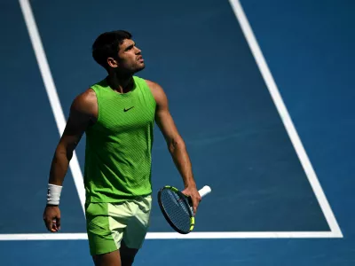 Tennis - Australian Open - Melbourne Park, Melbourne, Australia - January 25, 2026 Spain's Carlos Alcaraz reacts during his fourth round match against Tommy Paul of the U.S. REUTERS/Jaimi Joy