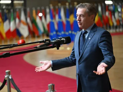 Slovenia's Prime Minister Robert Golob speaks with the media as he arrives for the EU summit in Brussels, Thursday, Jan. 22, 2026. (AP Photo/Harry Nakos)