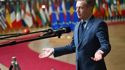 Slovenia's Prime Minister Robert Golob speaks with the media as he arrives for the EU summit in Brussels, Thursday, Jan. 22, 2026. (AP Photo/Harry Nakos)