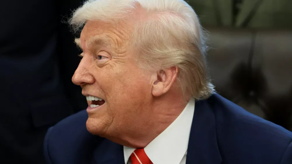 U.S. President Donald Trump reacts during the signing of a bill to end the partial government shutdown, at the White House in Washington, D.C., U.S., February 3, 2026. REUTERS/Evelyn Hockstein
