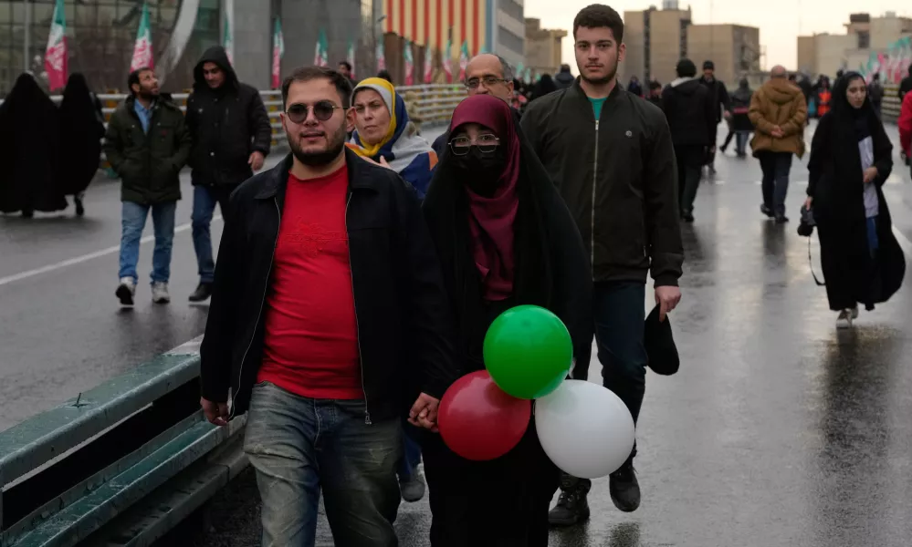 People attend a state-organised rally in Tehran, Iran, Wednesday, Feb. 4, 2026, celebrating the birthday of Imam Mahdi, or "Hidden Imam," a 9th-century saint whom Shiite Muslims believe will return at the end of time as a universal reformer to end tyranny and promote justice. (AP Photo/Vahid Salemi)