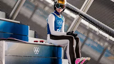 Nika Prevc, of Slovenia, waits her turn to jump during a ski jumping, women's normal hill, training session, at the 2026 Winter Olympics, in Predazzo, Italy, Thursday, Feb. 5, 2026. (AP Photo/Matthias Schrader)