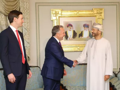 In this photo released by the Oman's Foreign Ministry, Steve Witkoff, White House special envoy, centre, shakes hands with Oman's Foreign Minister Sayyid Badr Albusaidi as Jared Kushner, left, looks on during their meeting prior to Iran and the U.S. negotiations, in Muscat, Oman, Friday, Feb. 6, 2026. (Oman Foreign Ministry via AP)