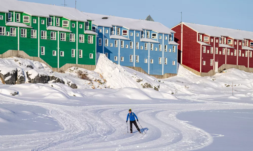 A person skis in Nuuk, Greenland, Friday, Feb. 6, 2026. (Christinne Muschi /The Canadian Press via AP)