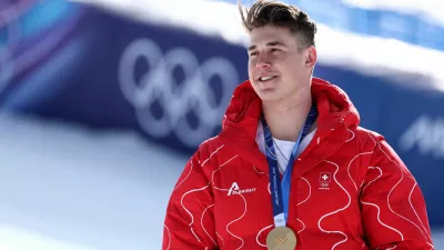 Milano Cortina 2026 Olympics - Alpine Skiing - Men's Downhill Victory Ceremony - Stelvio Ski Centre, Bormio, Italy - February 07, 2026. Gold medallist Franjo von Allmen of Switzerland celebrates on the podium after winning the Men's Downhill REUTERS/Gintare Karpaviciute