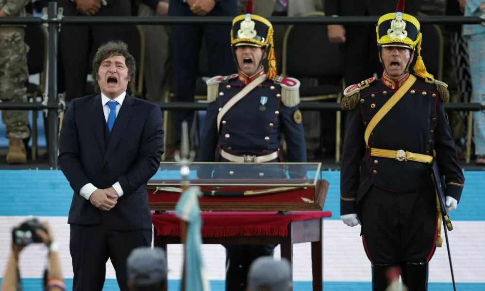 Argentina's President Javier Milei stands in front of the curved sabre that belonged to Argentina's independence leader General Jose de San Martin, during a ceremony to present it to the San Lorenzo regiment, in San Lorenzo, Santa Fe, Argentina, February 7, 2026. REUTERS/Francisco Loureiro   TPX IMAGES OF THE DAY