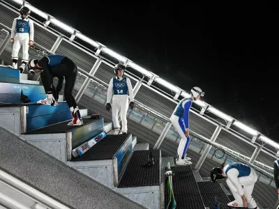 Milano Cortina 2026 Olympics - Ski Jumping - Men's Normal Hill - Official Training - Predazzo Ski Jumping Stadium, Predazzo, Italy - February 08, 2026. General view as athletes warm up before training REUTERS/Kai Pfaffenbach