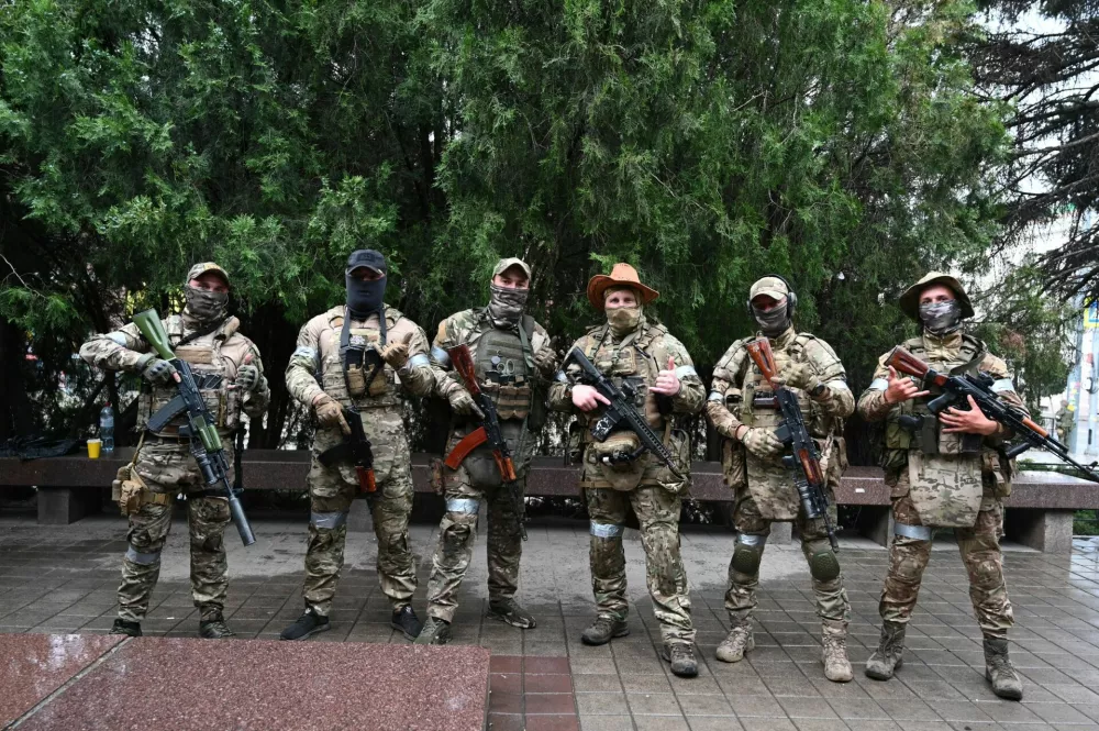 Fighters of Wagner private mercenary group pose for a picture as they get deployed near the headquarters of the Southern Military District in the city of Rostov-on-Don, Russia, June 24, 2023. REUTERS/Stringer