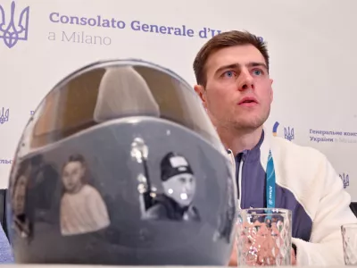 12 February 2026, Italy, Milan: Ukrainian skeleton racer Vladyslav Heraskevych speaks at a press conference at the Ukrainian Consulate in Milan, on the sidelines of the Milano Cortina 2026 Winter Olympic games. Heraskevych was disqualified from the competition because he insisted on wearing a helmet with photos of Ukrainian athletes who were killed in Russia's war of aggression. Photo: Peter Kneffel/dpa