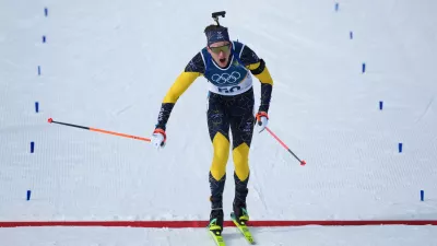 Martin Ponsiluoma, of Sweden, crosses the finish line of the men's 10-kilometer sprint biathlon race at the 2026 Winter Olympics in Anterselva, Italy, Friday, Feb. 13, 2026. (AP Photo/Andrew Medichini)