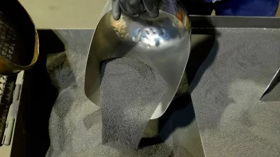 FILE - A worker shows sample of nickel matte at a processing plant in Sorowako, South Sulawesi, Indonesia, Sept. 12, 2023. (AP Photo/Dita Alangkara, File)