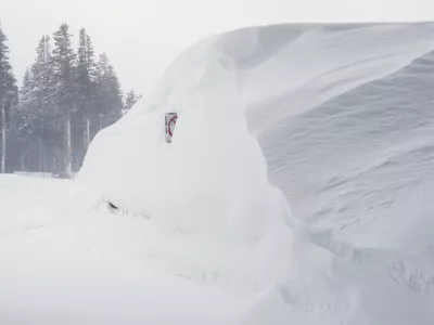 Snow piles up along a road on Wednesday, Feb. 18, 2026 near Soda Springs, Calif. (AP Photo/Brooke Hess-Homeier)
