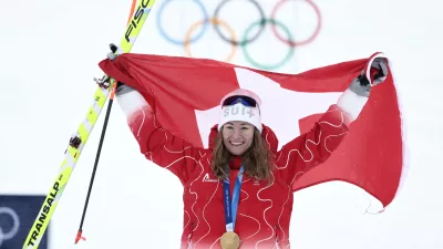 Switzerland's Marianne Fatton celebrates winning a gold medal a ski mountaineering women's final at the 2026 Winter Olympics, in Bormio, Italy, Thursday, Feb. 19, 2026. (AP Photo/Gabriele Facciotti)